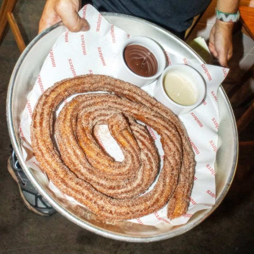 Spiral churros with two dipping sauces.